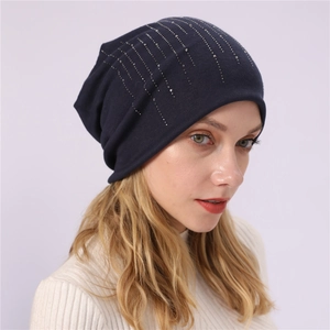 Close-up of navy cotton slouchy beanie with vertical silver rhinestone line details