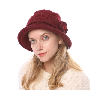 Detailed close-up of wine red knit flower basin hat for women in warm winter style