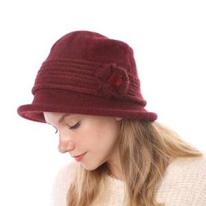 Close-up of a maroon knitted cloche hat featuring double-layer warmth and flower detail