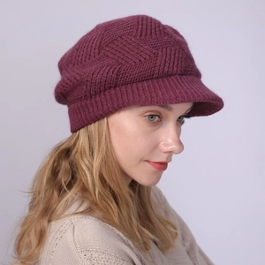 Detail of plum knit visor beanie showing textured diamond pattern and rib stitching