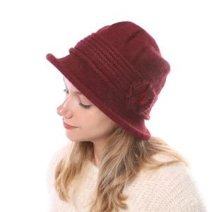 Close-up of side knitted flower detail on a burgundy wool blend winter bucket hat