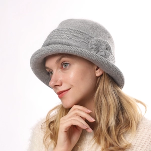 Detailed texture of gray knit floral cloche hat with soft faux rabbit fur for women