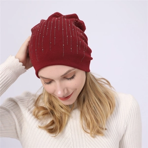 Detailed view of wine red cotton beanie with sparkling silver rhinestone embellishments