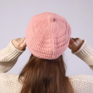 Detail view of pink striped knit beret showing premium ribbed texture and warm fabric