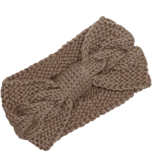 Close-up of brown cable knit headband with bow detail and soft handmade wool texture