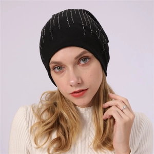 Close-up of black cotton slouchy beanie with vertical silver rhinestone details