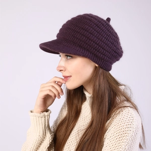 Close-up of a women's dark purple striped knit hat with soft mohair texture and brim