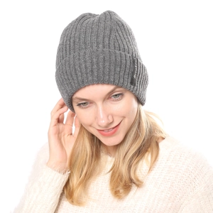 Detail of grey ribbed knit beanie showing thick wool texture and Breakout letter patch