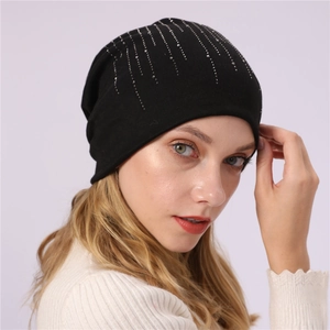 Close-up of black cotton slouchy beanie with radiant silver rhinestone detailing