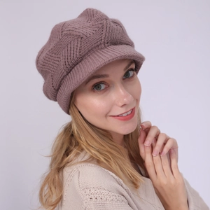 Close-up of a women's purple knitted visor beanie with thick herringbone stitch pattern