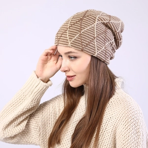 Detail of warm knit beanie featuring beige and coffee geometric diamond patterns