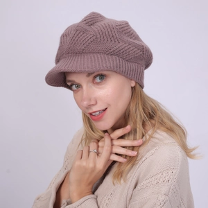 Close-up of pink twill knit beret featuring warm fleece lining and textured pattern