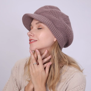 Close-up of mauve twill knit peaked beret with thick geometric textured warm lining