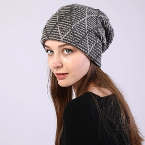 Detail of grey slouchy beanie featuring a 3D geometric diamond knit pattern for winter