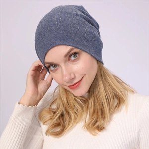 Stylish blue slouchy knit beanie for men and women featuring silver rhinestone stripes