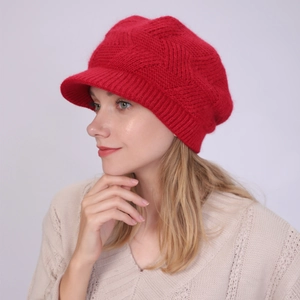 Side view of red twill knit baker boy hat with brim for warm winter headwear
