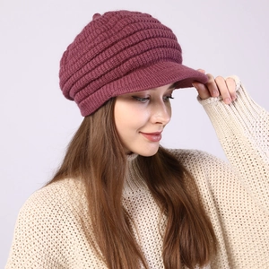 Detail of dark purple ribbed knit visor beanie showing winter texture and thick pattern