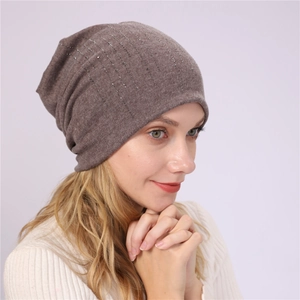 Close-up of brown cotton slouchy beanie featuring sparkling silver rhinestones detail