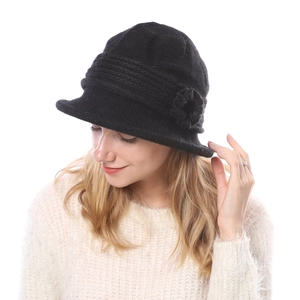 Close-up of black knit cloche hat featuring double-layer wool blend and 3D floral detail