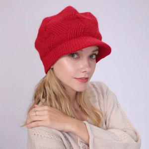 Close-up of red twill knit baker boy hat showing detailed diamond texture and soft brim