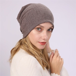 Detailed view of brown cotton slouchy beanie with elegant vertical rhinestone accents