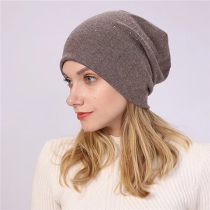 Detail of coffee brown slouchy beanie with silver rhinestone vertical stripes