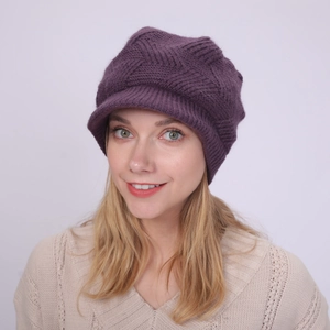 Detail of deep purple knit visor beanie showing thick V-shaped textured warm fabric