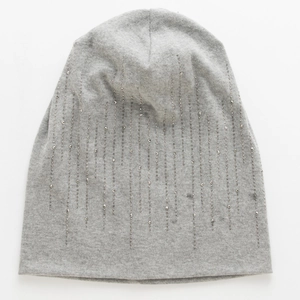 Close-up of light grey cotton slouchy beanie featuring vertical silver rhinestone patterns