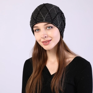 Close-up of the knitted beanie showing black and grey geometric diamond patterns