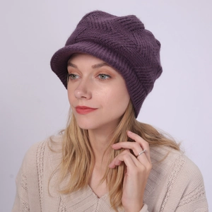 Detail of purple knit visor beanie with cable stitch pattern and warm fleece lining