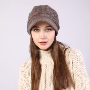 Detailed knit texture and brim of a warm coffee-colored winter baker boy hat
