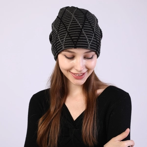 Detail of geometric diamond knit pattern on winter fleece-lined warm beanie hat