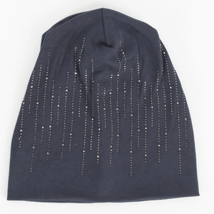 Detailed view of dark grey cotton beanie with silver rhinestone vertical stripe patterns