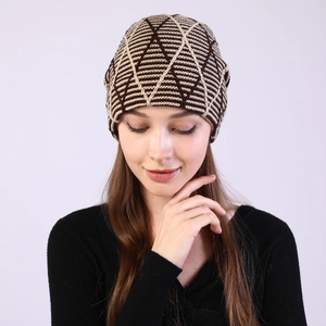 Close-up of winter knit beanie featuring brown and beige diamond geometric patterns