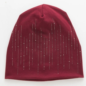 Detailed view of dark red cotton beanie featuring vertical silver rhinestone patterns