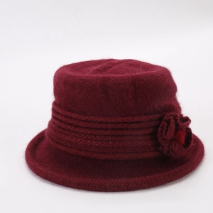 Detailed knit texture of burgundy cloche hat with an elegant floral accent on the side