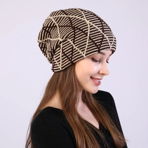 Detail of soft chunky knit texture on slouchy beanie with geometric grid pattern