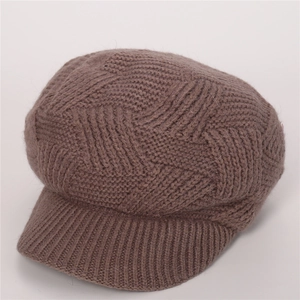 Detail of coffee brown twill knit newsboy hat showing thick wool texture and warm fabric