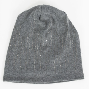 Detail of dark grey knit beanie featuring vertical silver rhinestone meteor patterns