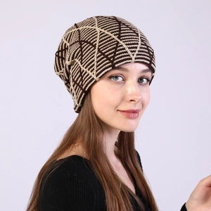Detail of winter beanie featuring geometric knit pattern and warm fleece lining