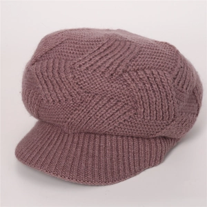 Detailed twill knit texture of pink winter newsboy hat with soft faux fur finish