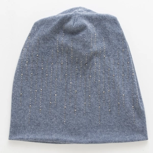 Detail of gray-blue knit beanie with shimmering vertical rhinestone and stud patterns