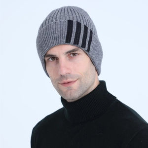 Close-up of grey ribbed knit beanie for men featuring stylish black side stripes