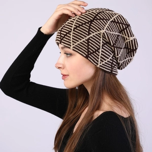 Detail view of winter knitted beanie featuring a textured geometric pattern and warm lining