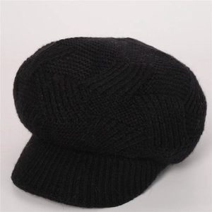 Close-up of black twill knit baker boy hat showing premium textured wool finish