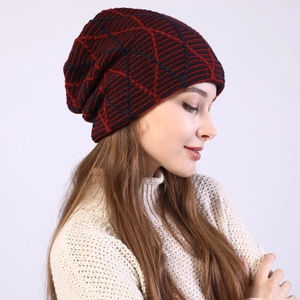 Detailed close-up of the red and black diamond pattern knit on this warm winter beanie