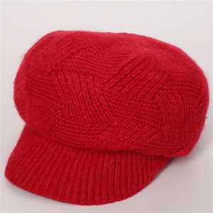 Close-up of red twill knit peaked cap showing thick fuzzy texture and ribbed brim details