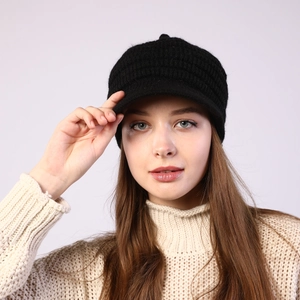 Detail of black ribbed knit peak cap with thick thermal lining for winter warmth