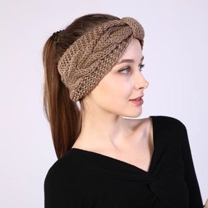 Detail of khaki cable knit headband for winter warmth and comfortable styling