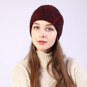Detail of burgundy and navy diamond-knit winter beanie with soft fleece lining
